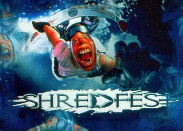 A photo-realistic, stylized image of a snowboarder with a wild and excited face, mouth agape, flying in the air with an arm extended towards the screen, while the Shredfest logo appears below.