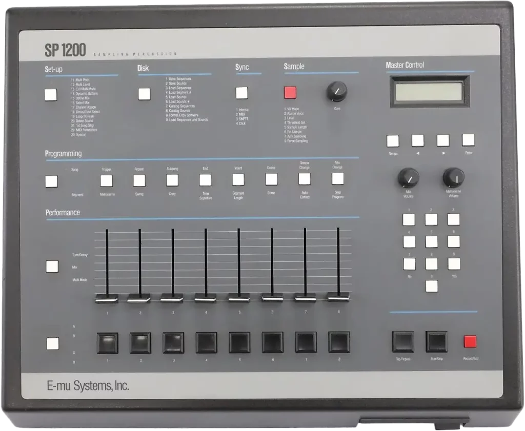 SP-1200 drum machine. A gray box with buttons and slider knobs, a small LCD screen and a floppy disk drive.